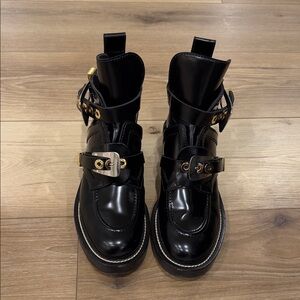 Balenciaga Black Leather Combat Boots with Gold Accents